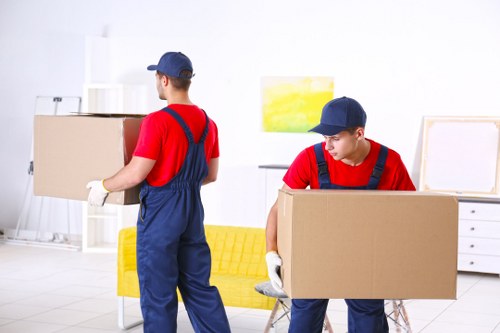 Movers handling a home move in Islington with boxes and furniture