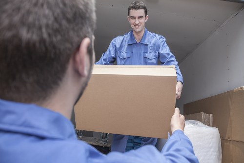 Moving team preparing a home relocation in an Islington street