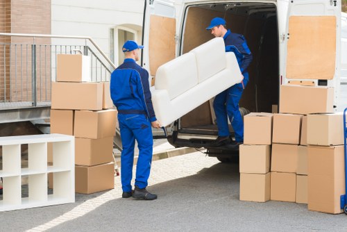 Moving van outside a London apartment building with stairs