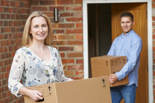 Packed moving boxes and furniture ready for a local house move in Islington