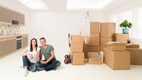 Packed moving boxes ready for collection in an Islington flat